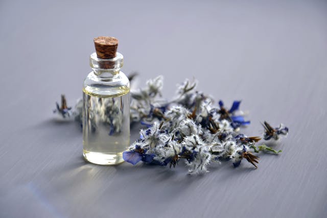 bottle of fragrance with flowers